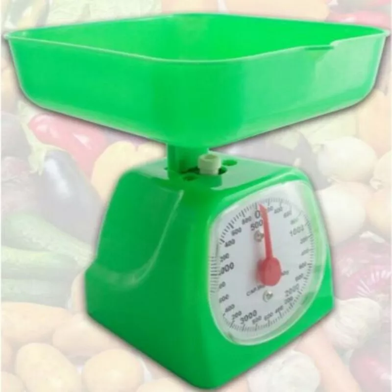 Manual scale for weighing items in the home kitchen. Isolated