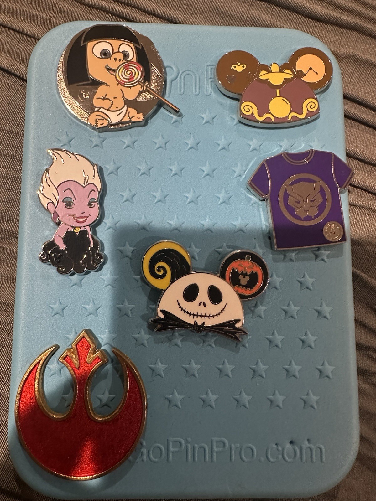 6 Authentic Disney Pins That Cones with A Blue Pinfolio Board Mickey Mouse