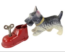 Early 1950's Wind-Up Celluloid "Scottie Dog Chewing Tin-Litho Shoe"