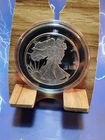 Walking Liberty, 1oz .999 Silver Round Proof from SMI in a capsule.