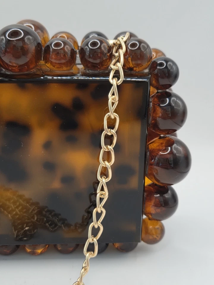 Cartera clutch Yendi leopardo tortuga acrílico Foto 4 de 4