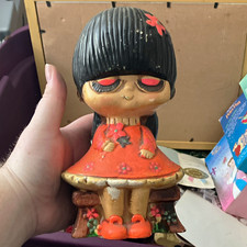 Ceramic Girl Character Piggy Bank Figure Black Hair Red/Orange Dress Flower
