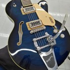 Teal GRETSCH G5655T-QM hollow body electric guitar with gold hardware, silver pickups, and adjustable Bigsby bridge.