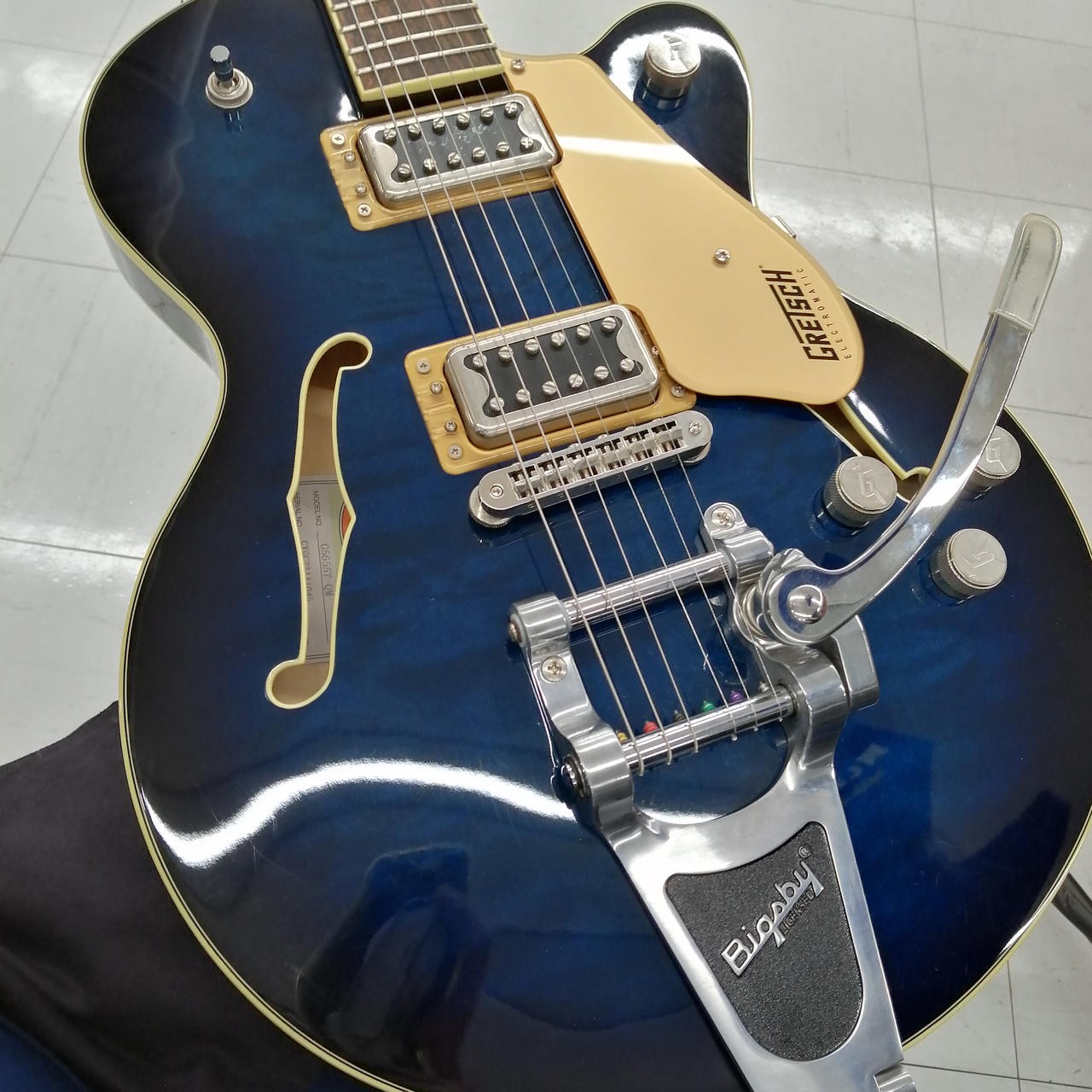 Teal GRETSCH G5655T-QM hollow body electric guitar with gold hardware, silver pickups, and adjustable Bigsby bridge.