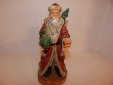 Vintage santa claus with tree and bag of goodies 1992