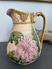 Ceramic majolica pitcher with floral design — photo 1