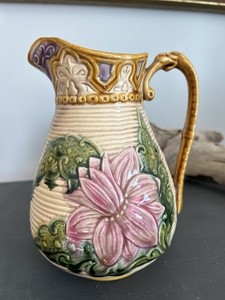 Ceramic majolica pitcher with floral design