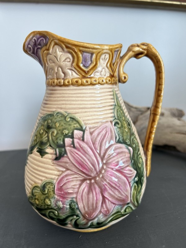 Ceramic majolica pitcher with floral design