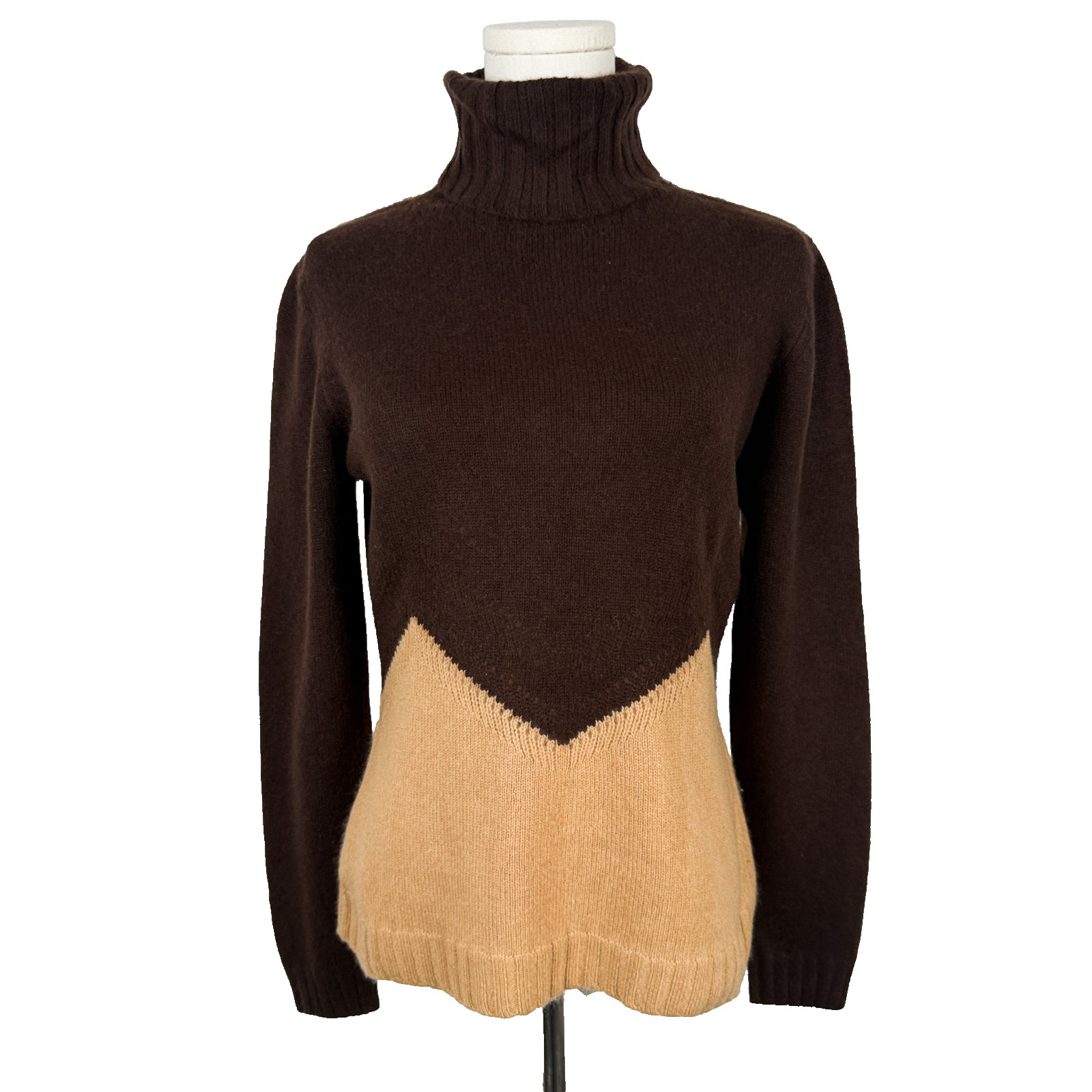 Brown and tan colorblock cashmere turtleneck sweater on a mannequin form.