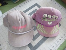 Pair of well used stained Arctic Cat Caps