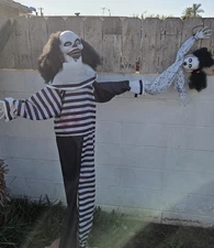 Haunted Hill Farm 5.4 ft Animatronic Clown with Doll Prop