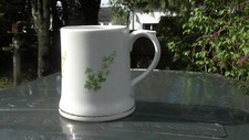Pottery Irish Wade mug with applied green shamrocks, 9.5cm Gaelic mark,Portadown