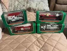 HESS SET OF 4 VOYAGER,TRANSPORT, RESCUE &FIRE TRUCK NEW