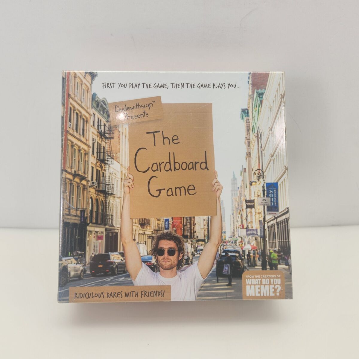 DUDE WITH SIGN'S THE CARDBOARD GAME, Ridiculous Dares with Friends!, DudewithSign's The Cardboard Game is full of ridiculous dares and is  available now at Target!, By What Do You Meme?