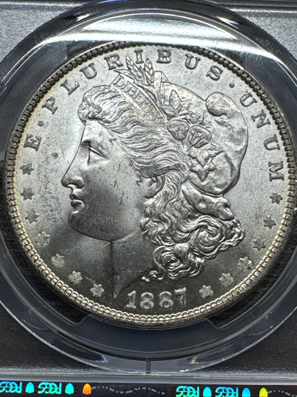 1887 PCGS MS65 -Bright Rainbow Reverse Toner VAM 35 Morgan Silver Dollar