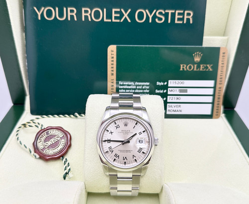 Rolex Date 115200 34mm Silver Roman Dial Stainless Steel Box Papers