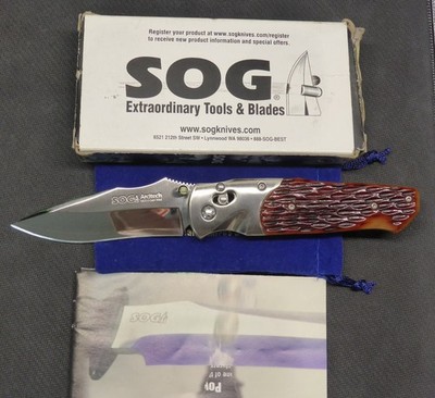 SOG Arcitech A01 Amber Jigged Bone Handle Mirror Pol. Blade Seki