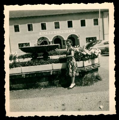 Woman at Fountain in Front of Olympic Film Stage Cinema Light Play Theatre - Photo 6x6cm