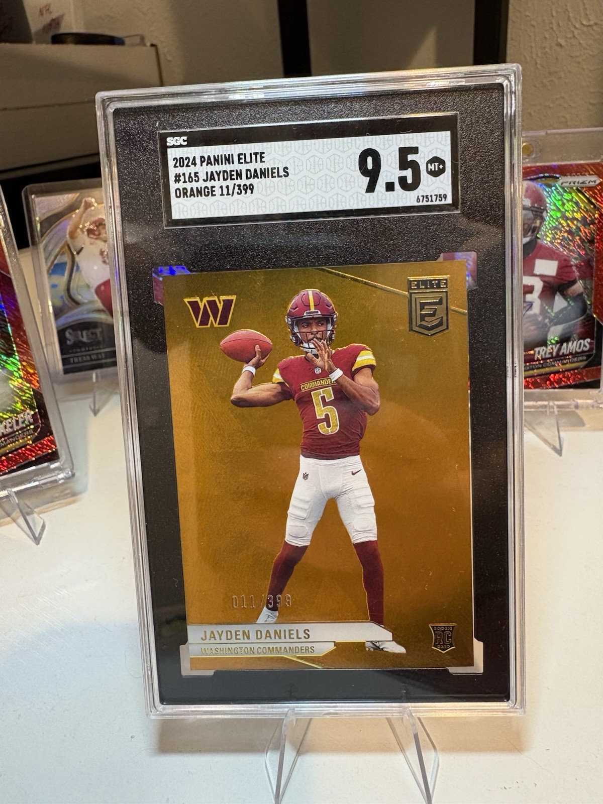 2024 Donruss Elite | #165 | Jayden Daniels | Orange | /399 | RC | SGC 9.5 Mint+