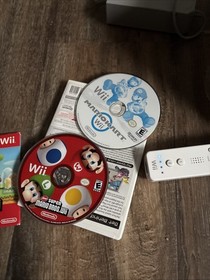 Wii Console With Mariokart And Mario Bros Wii