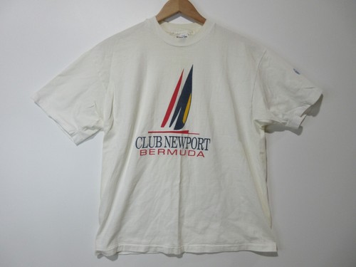 White short-sleeve T-shirt with red and black Club Newport Bermuda logo and navy swoosh on left chest, USA MADE text below.