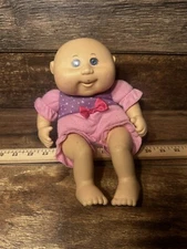 2009 Cabbage Patch Kids Doll Bald Blue Eyed Baby in pink and purple