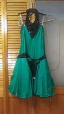 Fancy and classy green costume with black elbow length gloves