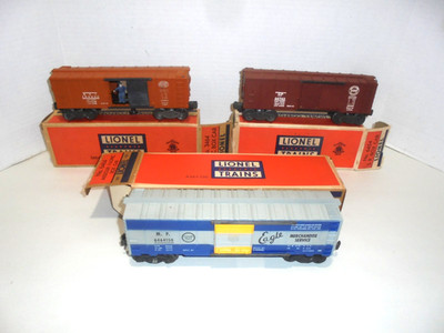 LIONEL SET OF THREE VINTAGE BOX CARS WITH BOXES THAT ARE PRETTY NICE O GAUGE