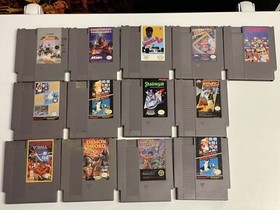 Nintendo NES console bundle with controllers, zapper, and games Tested