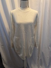 NWT. Beautiful Women's Sweater with delicate designs. Size M/L. Side pockets.