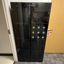 Black Glass Floor Standing Display Case with Shelves and Enclosed Storage