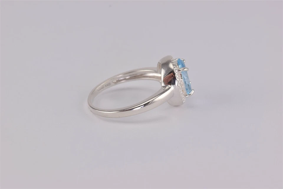 Anillo de plata esterlina ovalado con topacio azul bisel de guijarros banda con halo DBJ 925 talla: 9 Foto 3 de 4