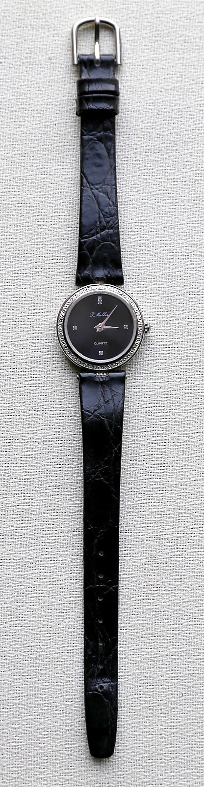 Montre quartz P.MULLER années 90 au boîtier métal blanc poli et finitions cuir de qualité