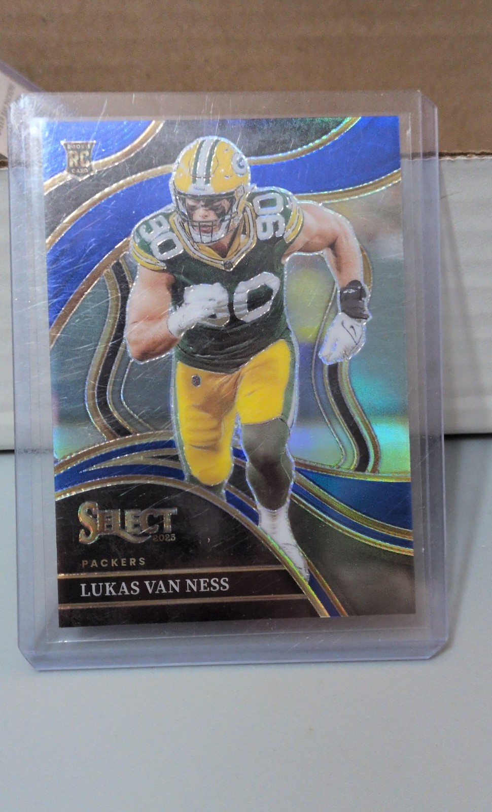 2023 Panini Select - Club Level Lukas Van Ness #239 Blue Prizm /99 (RC)