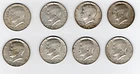 Eight Kennedy Half Dollars—1964–1969. Good condition but all appear circulated.
