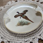 Lenox porcelain ashtray with gold trim, featuring colorful pheasant bird design and gold cigarette rests.