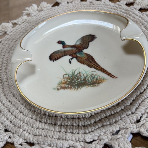 Lenox porcelain ashtray with gold trim, featuring colorful pheasant bird design and gold cigarette rests.