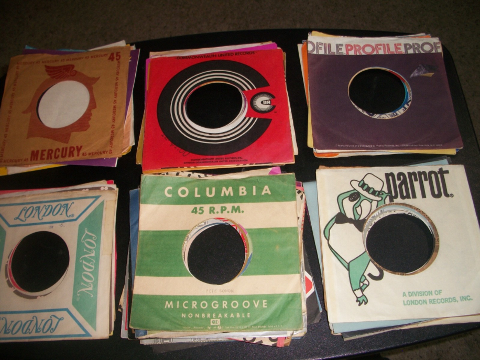 65 Different 45 RPM Company Record Sleeves-Used-Excellent condition