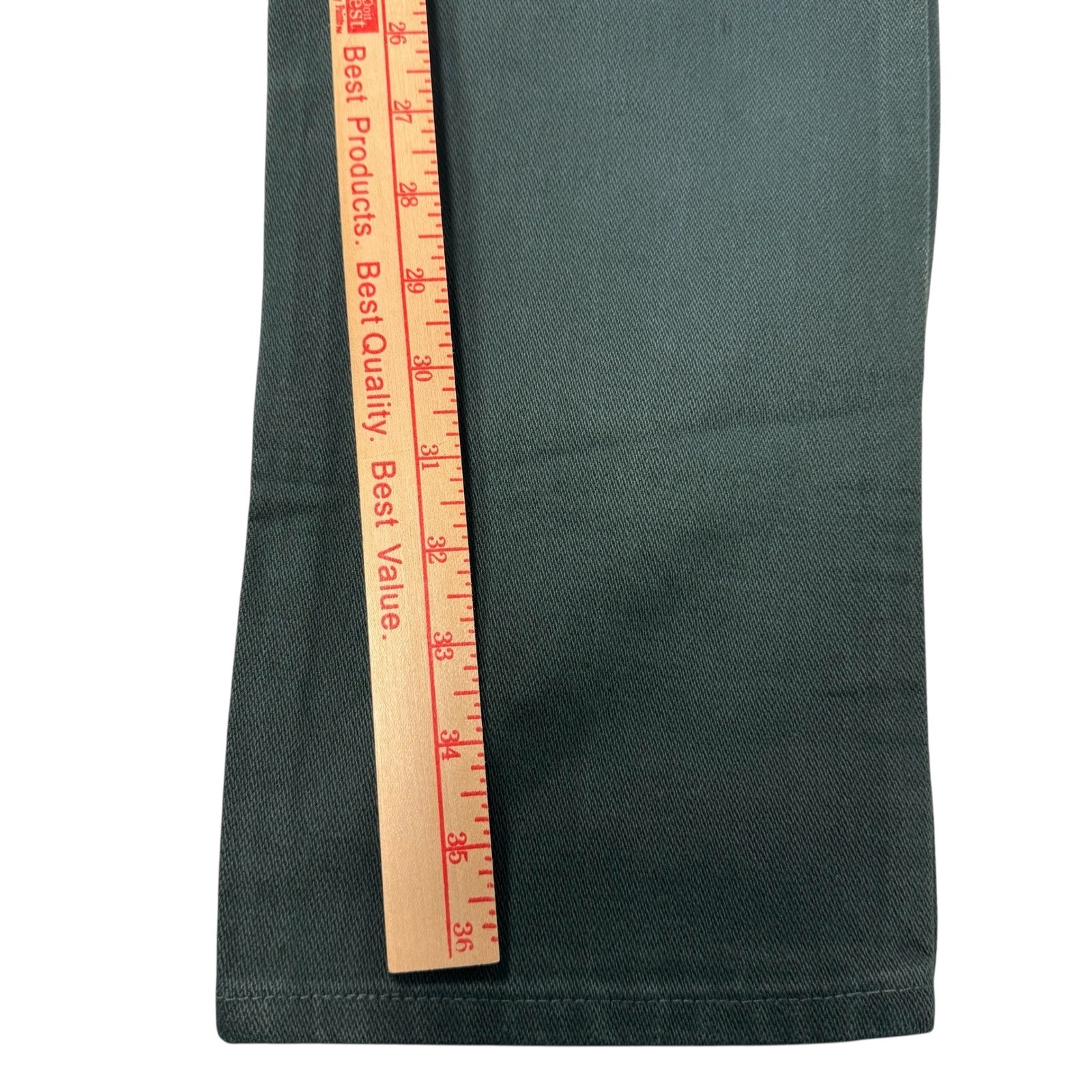 Wrangler silver lake western jeans, 3/4 x 36, with dark green fabric, shown beside a wooden ruler for scale.
