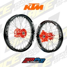 SM PRO PLATINUM WHEEL SET KTM 125-450 SX/SXF 23-26 ORANGE HUB BLACK RIM