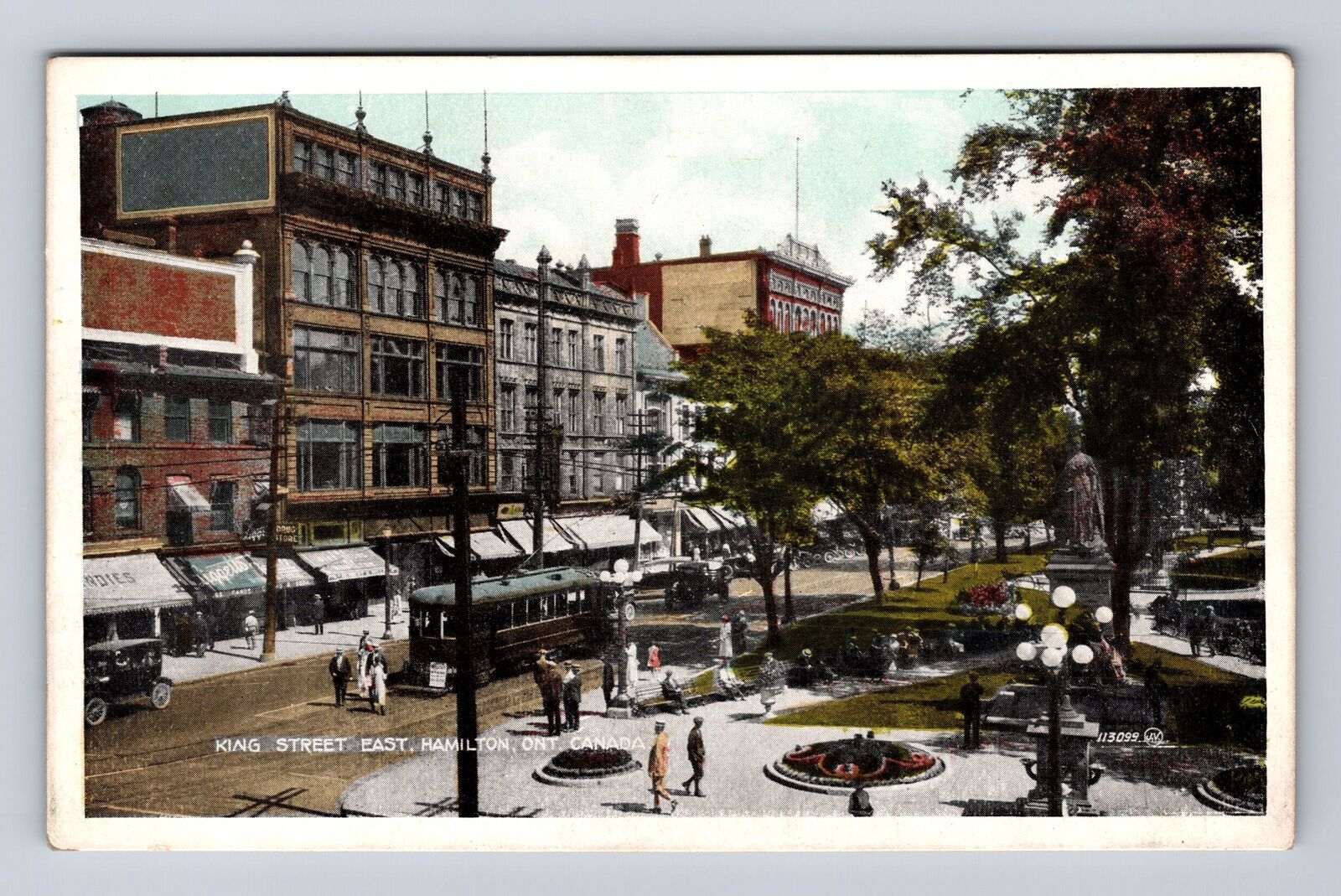 Vintage postcard of Hamilton Canada King Street East town square statue and trolley  