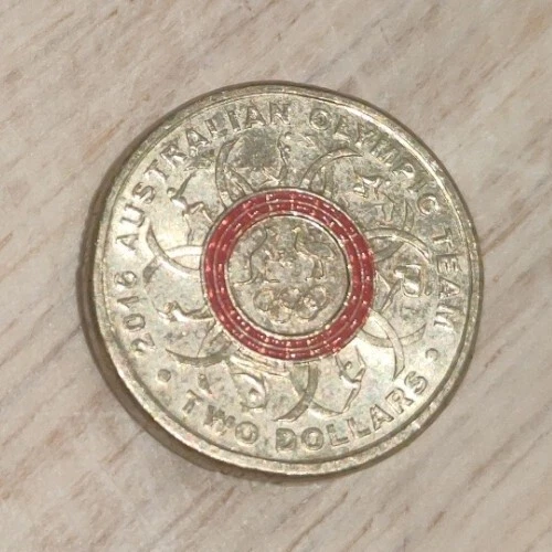 Two dollar coin with red ring sale