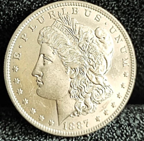 1887 O Morgan Dollar MS+ Great Eye Appeal Excellent Strike. 100% Original White