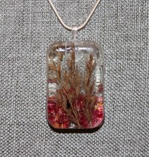 Wonderful dried Foliage with dried rose petals are incased in clear Resin