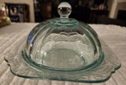 Aqua Depression glass butter dish with etched floral pattern and domed lid.