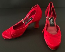 A PAIR OF CHITA RIVERA OWNED  WORN VIBRANT RED CUSTOM MADE T.O.DEY DANCE HEELS 
