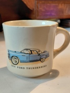 1956 Ford Thunderbird coffee drink mug Car is blue with white top. One chip.