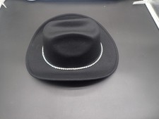 black western-style hat with a wide brim and a rhinestone band