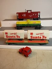 Lot 3 Tyco HO Scale Freight Cars: Santa Fe Piggy-Back Flat, DuPont Tank, Caboose