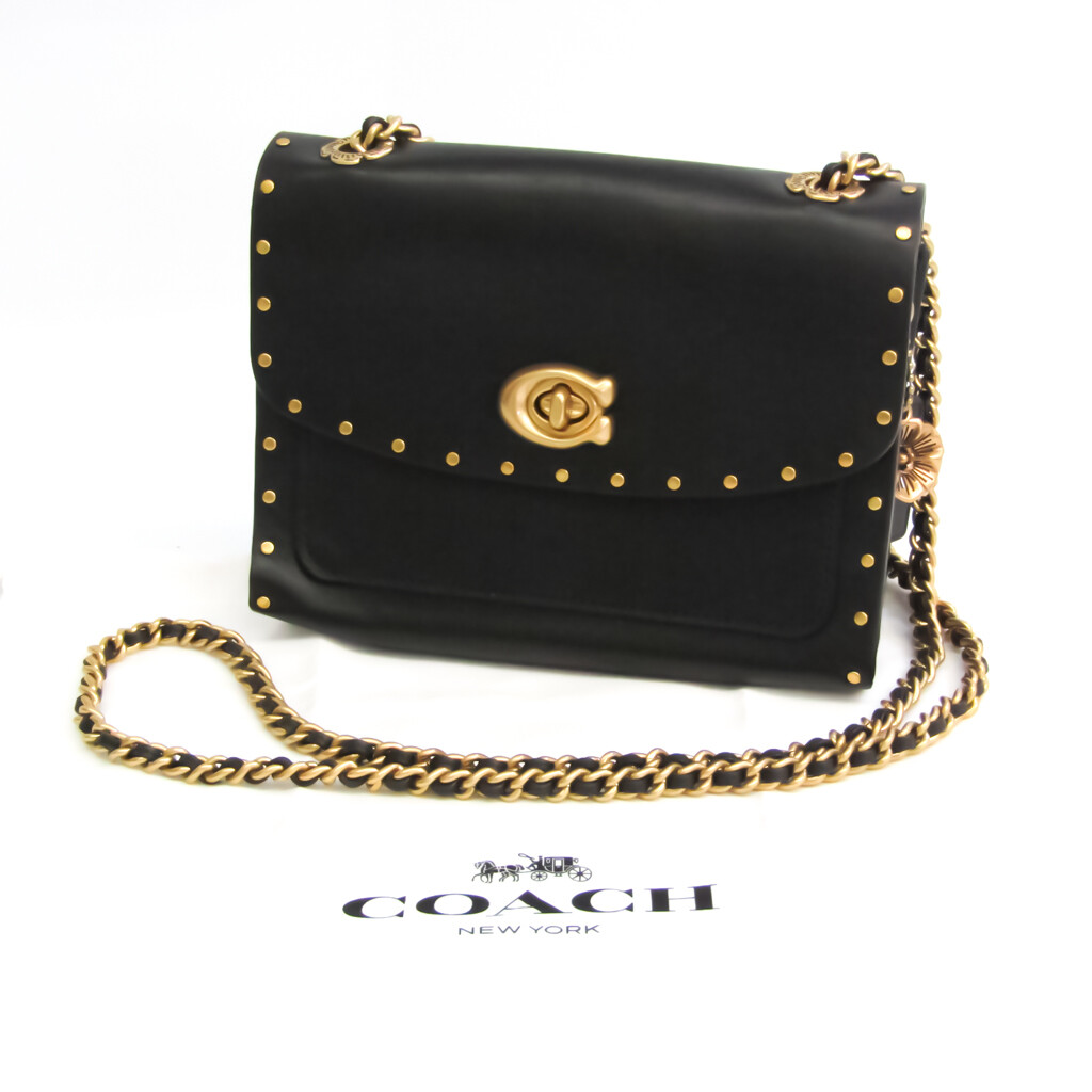 coach border rivets parker 18 shoulder bolsa